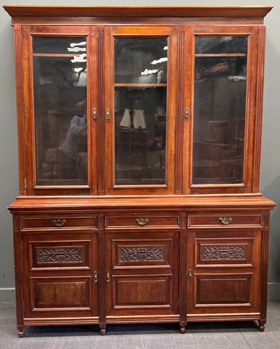 Lot 340 - An Edwardian glaze top bookcase cabinet with...