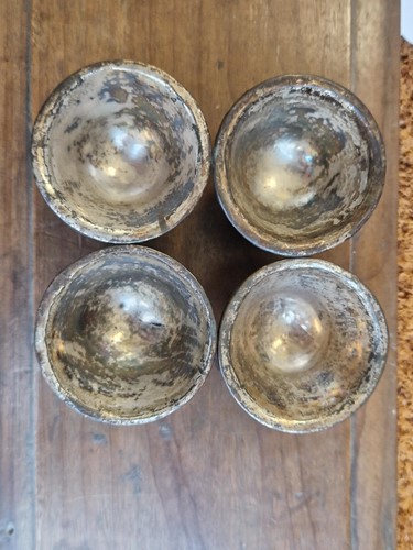 Lot 53 - A set of eight Chinese export carved and silver mounted coconut wood wine cups, Qing Dynasty, early 19th century