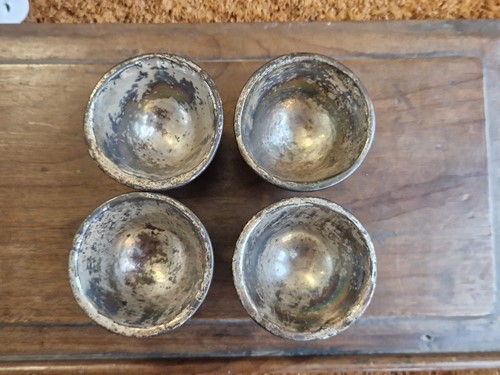 Lot 53 - A set of eight Chinese export carved and silver mounted coconut wood wine cups, Qing Dynasty, early 19th century