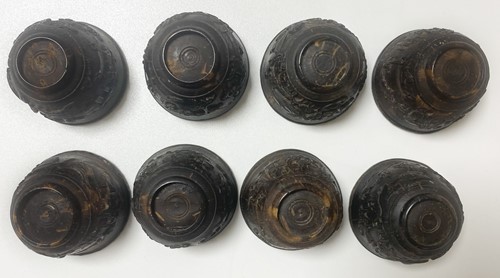 Lot 53 - A set of eight Chinese export carved and silver mounted coconut wood wine cups, Qing Dynasty, early 19th century