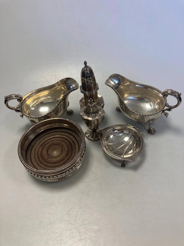 Lot 194 - A collection of silverware including bottle...
