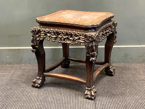 Lot 406 - A Chinese hard wood urn stand with marble...
