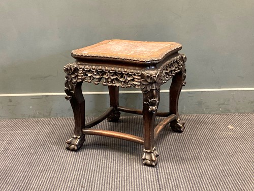 Lot 406 - A Chinese hard wood urn stand with marble...