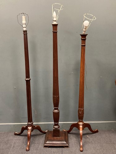 Lot 806 - Three mahogany torcheres converted to standard...