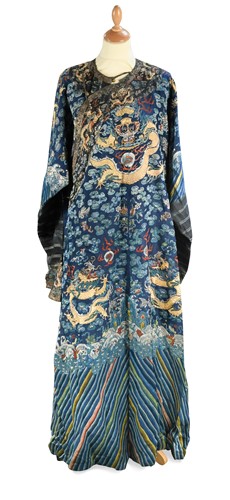 Lot 72 - A Chinese embroidered silk blue ground dragon robe, late Qing Dynasty