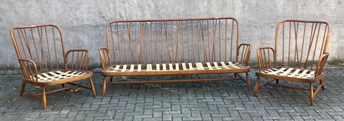 Lot 432 - A three piece Ercol lounge suite to include a...