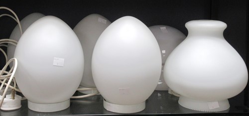 Lot 76 - Four 1980's egg form white opaque glass lamps,...
