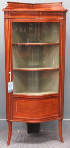 Lot 664 - An Edwardian mahogany freestanding corner...