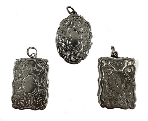 Lot 410 - A trio of Victorian silver miniature vinaigrettes