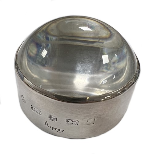 Lot 434 - An Elizabeth II silver table magnifying glass, mark of Asprey & Co.