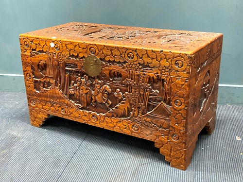 Lot 403 - A heavily carved far east camphor wood blanket...