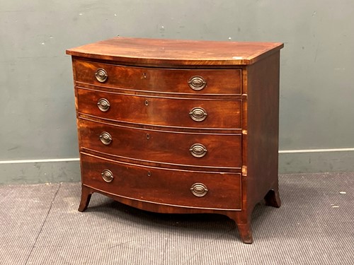 Lot 457 - A 19th century mahogany bowfront chest of four...