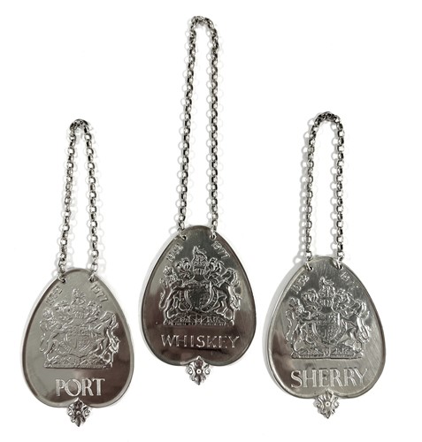 Lot 432 - A set of three Elizabeth II silver commemorative decanter labels
