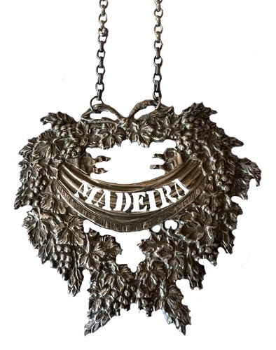Lot 431 - An Elizabeth II cast silver oversized decanter label