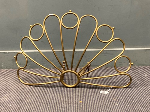 Lot 462 - An unusual brass fire guard, modelled as...