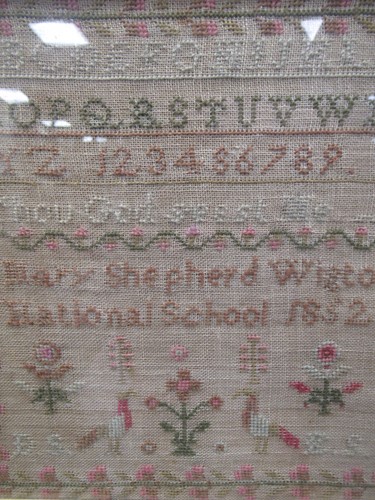 Lot 238 - A 19th century sampler, embroided with the...