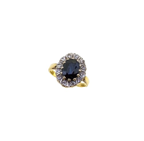 Lot 201 - A sapphire and diamond cluster ring