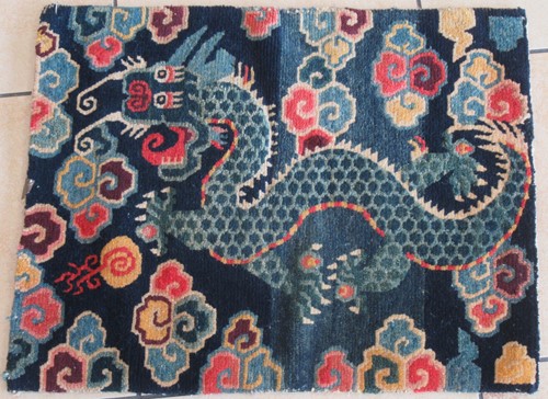 Lot 478 - A Tibetan Gomden pillow rug, 20th century