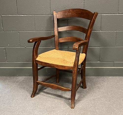 Lot 754 - Rush seat ladder back arm chair