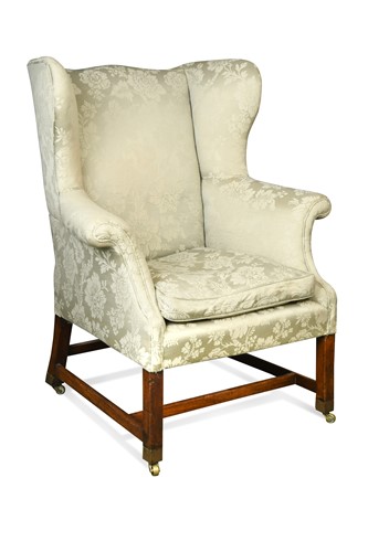 Lot 591 - A George III mahogany wing back armchair