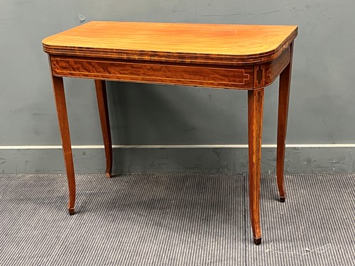 Lot 871 - A Regency mahogany tea table with box wood stringing