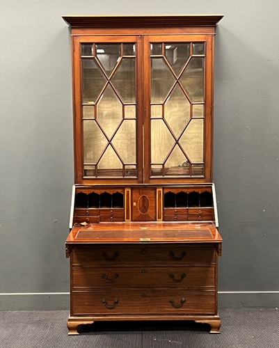 Lot 688 - A mahogany astragal glazed bureau bookcase,...