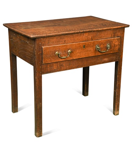 Lot 547 - A small George III oak side table
