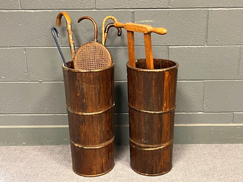 Lot 699 - A pair of stained pine walking stick stands 63...