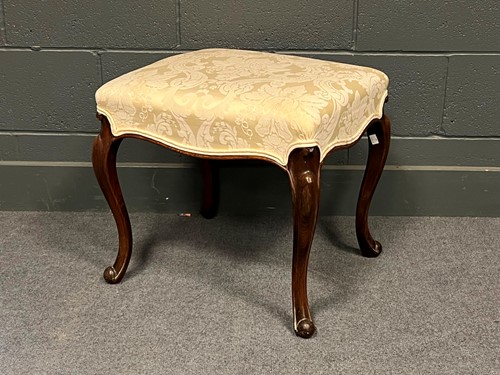 Lot 740 - A walnut stool on cabriole legs, upholstered...