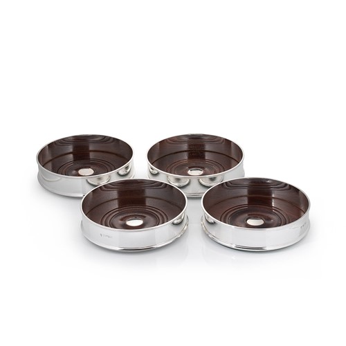 Lot 568 - A set of four Elizabeth II silver bottle coasters