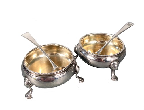 Lot 491 - A pair of George III 18th century silver cauldron salts with two others and associated spoons
