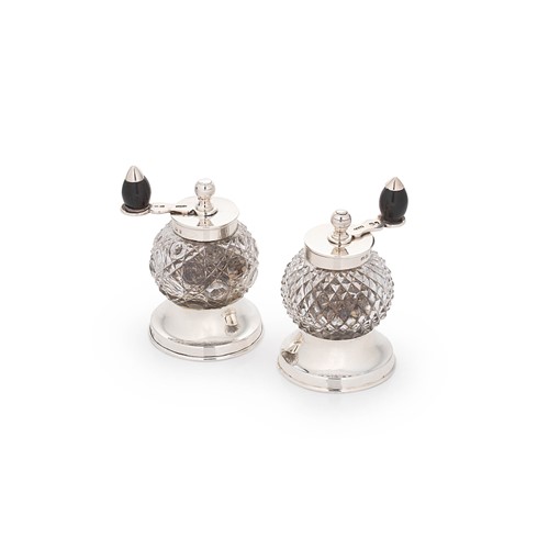 Lot 503 - A Victorian silver and cut glass pepper mill, together with a very similar, but later, example