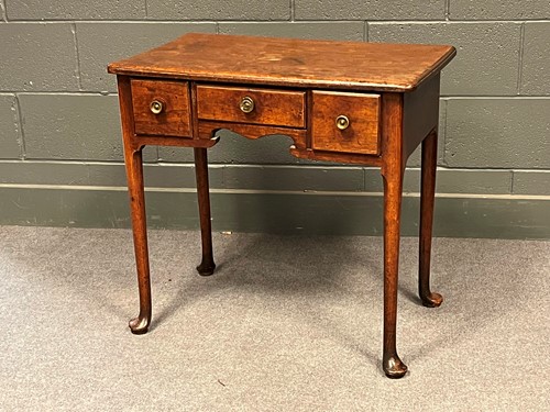 Lot 796 - A George III mahogany lowboy, with three...