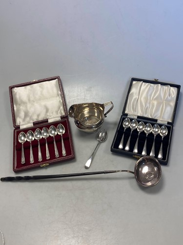 Lot 188 - Two cased sets of silver spoons, together with...