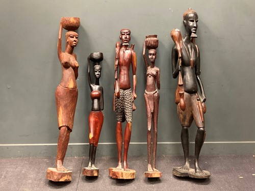 Lot 461 - A group of five carved wood African figures,...