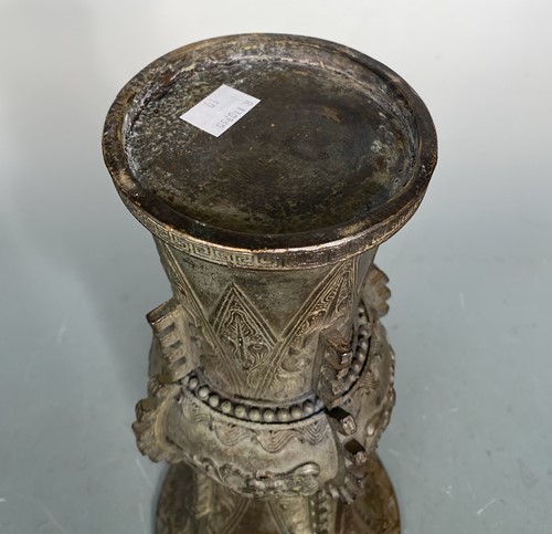 Lot 21 - A Chinese bronze Gu vase in archaic style