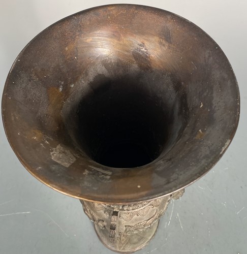 Lot 21 - A Chinese bronze Gu vase in archaic style