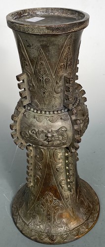 Lot 21 - A Chinese bronze Gu vase in archaic style