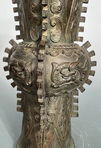 Lot 21 - A Chinese bronze Gu vase in archaic style