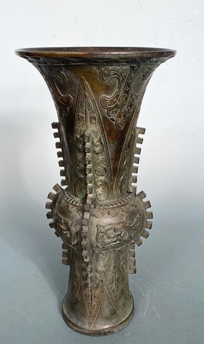 Lot 21 - A Chinese bronze Gu vase in archaic style