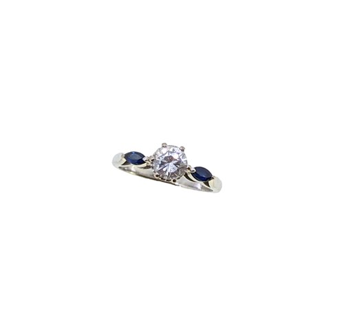 Lot 196 - A three stone diamond and sapphire ring