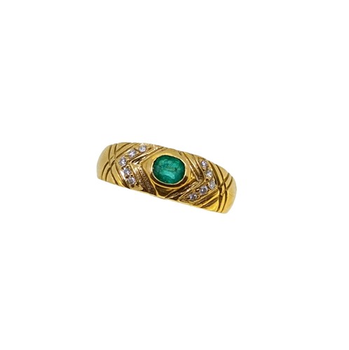 Lot 89 - An emerald and diamond dress ring