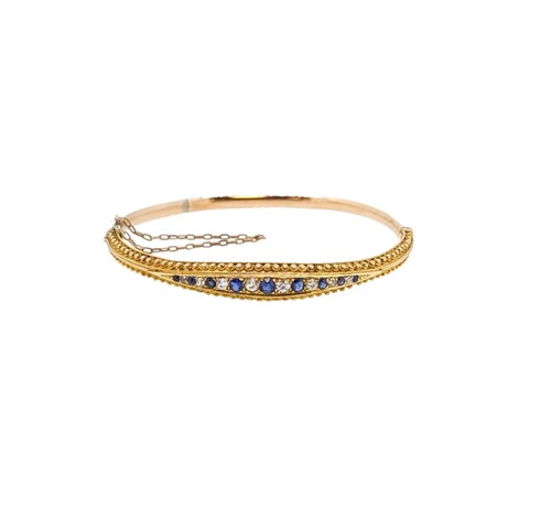 Lot 198 - A sapphire and diamond bangle