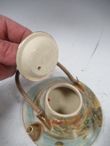 Lot 72 - A Satsuma pottery small teapot and cover,...