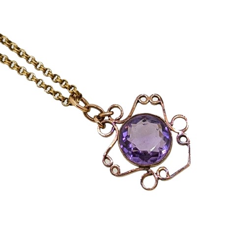 Lot 77 - An amethyst pendant and chain