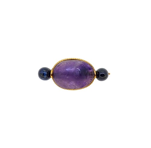 Lot 79 - An amethyst and sapphire scarab brooch