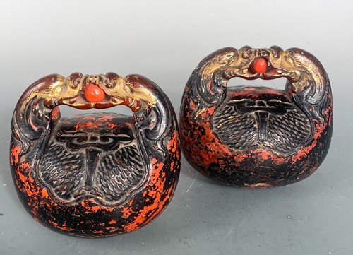 Lot 23 - A pair of Japanese carved and red lacquered Zen temple bells, Mokuygo, late Meiji Period