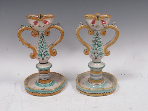 Lot 26 - A pair of Maiolica candlesticks, 23cm high