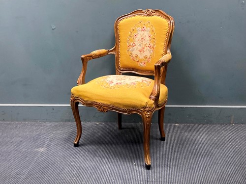 Lot 845 - A Louis XV style walnut open armchair, with...
