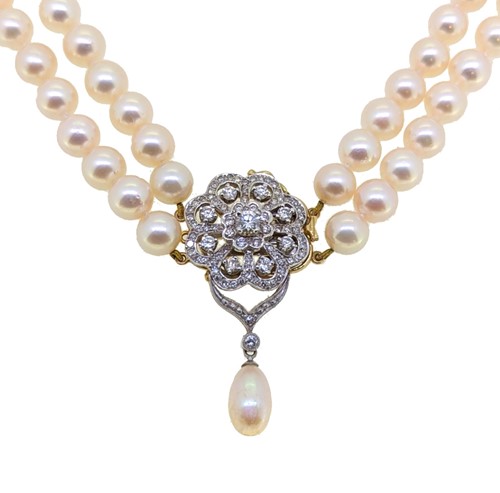 Lot 233 - A double row pearl and diamond necklace